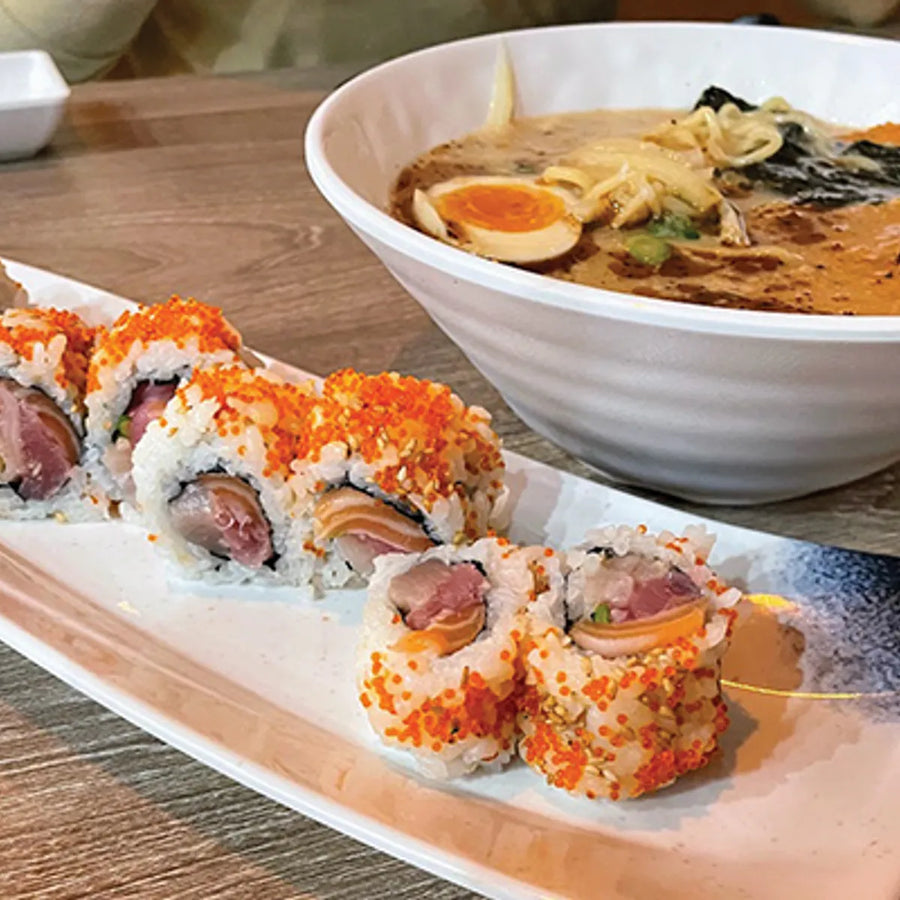 Sushi rolls beside a bowl of ramen with egg at Nami Lily in South Jordan