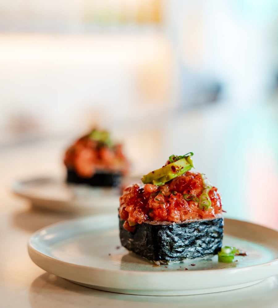 Poke piled over rice and wrapped in nori at Side of Aloha