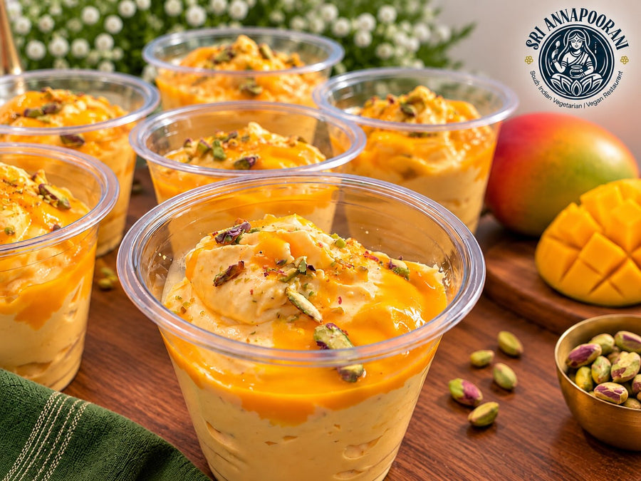 Mango dessert cups topped with chopped nuts at Sri Annapoorani